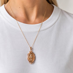 Médaille en or rose et perle