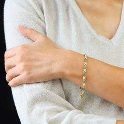 Bracelet Ligne en or jaune, émeraudes et diamants
