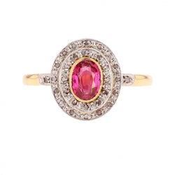Bague Entourage en or jaune, platine, rubis et diamants