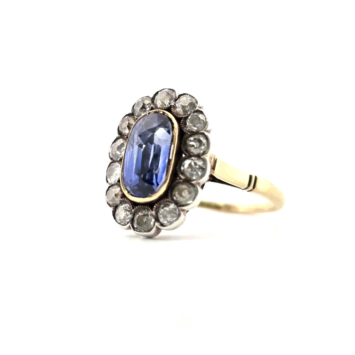 Bague Entourage en or jaune, argent, saphir et diamants