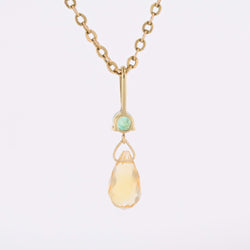 Pendentif en or jaune, émeraude et citrine