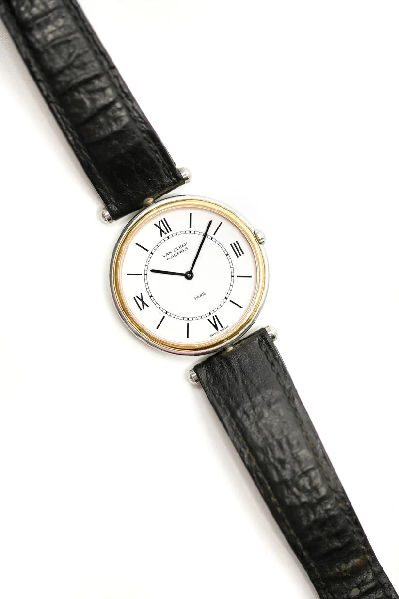 Montre VAN CLEEF & ARPELS PA 49 en or jaune, acier et cuir