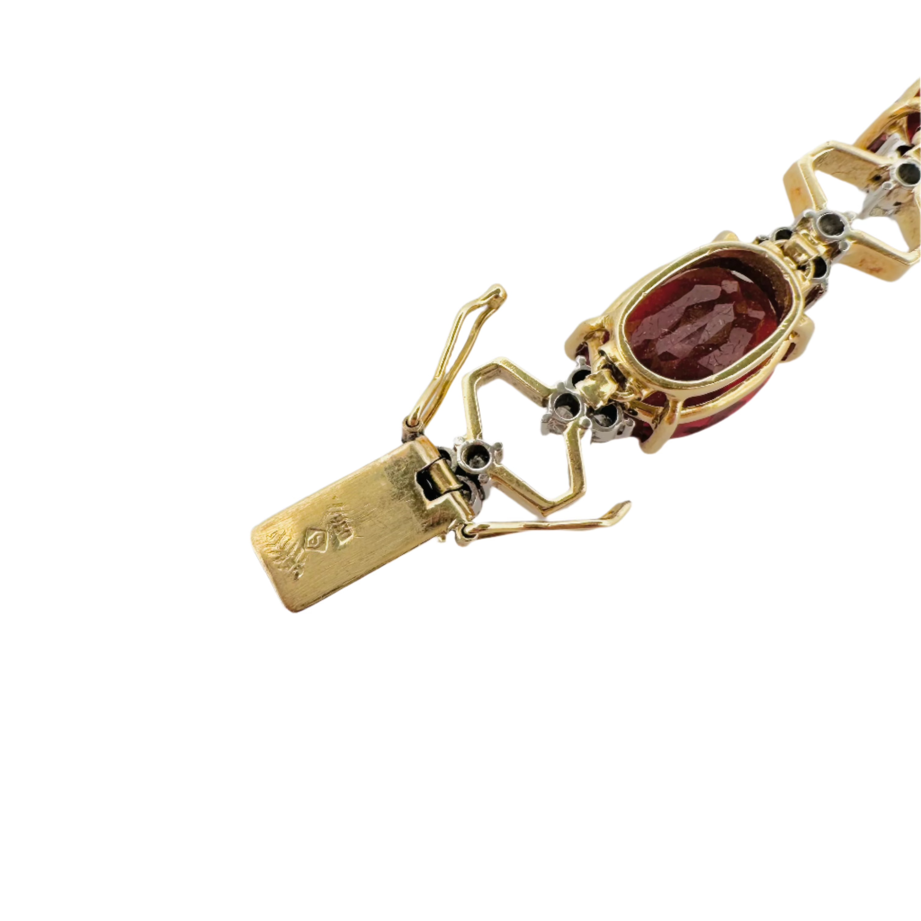Bracelet articulé en or jaune, platine, grenats et diamants
