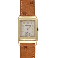 Montre JAEGER LECOULTRE Reverso Vintage en or blanc, or jaune et cuir