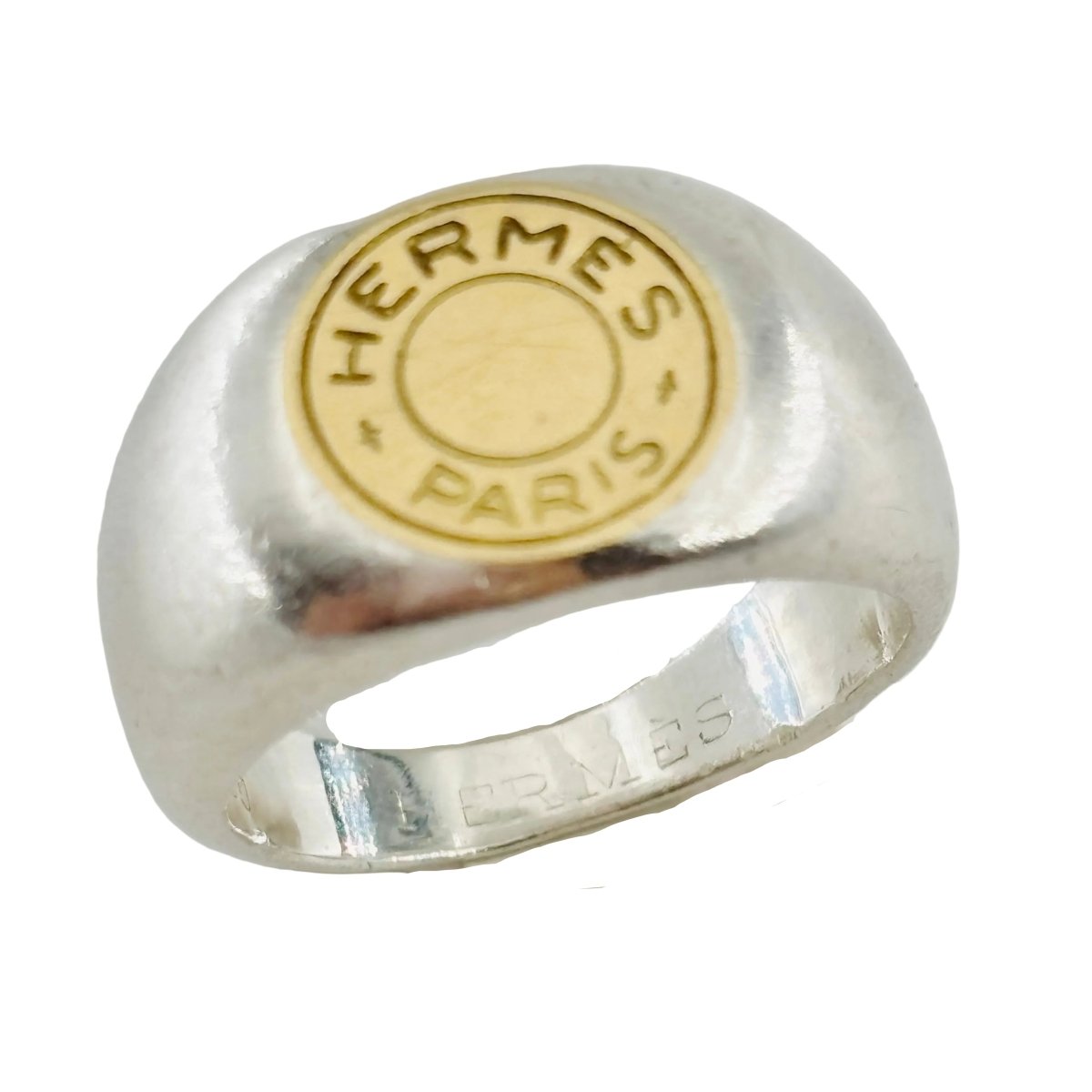 Bague Chevalière HERMÈS "Clou de selle" en argent et or jaune - Castafiore