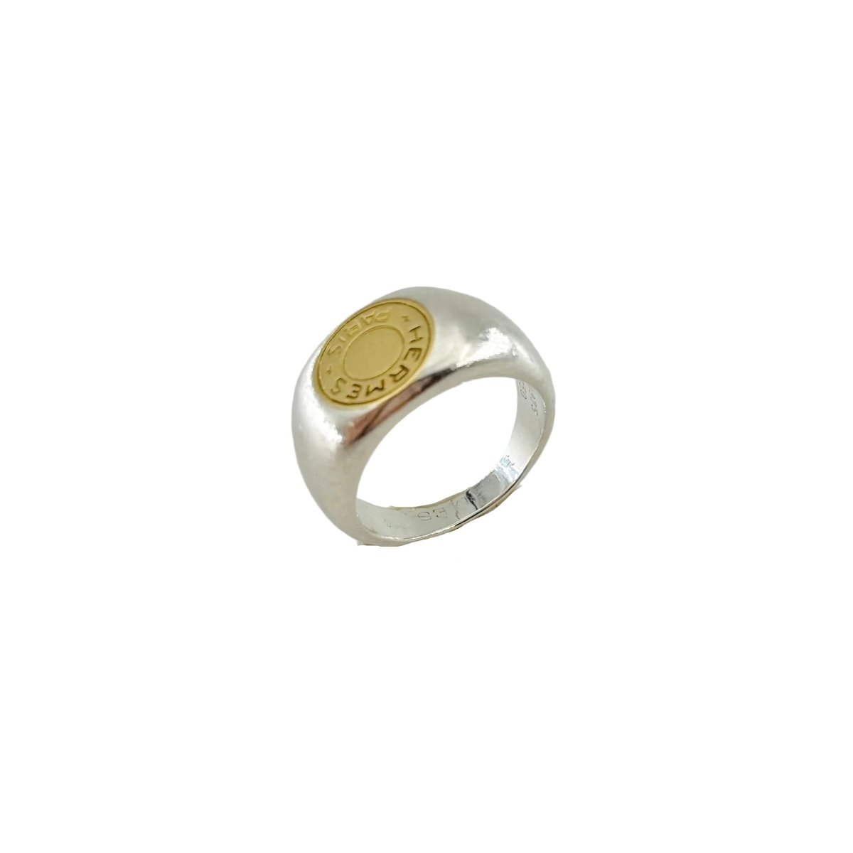 Bague Chevalière HERMÈS "Clou de selle" en argent et or jaune - Castafiore