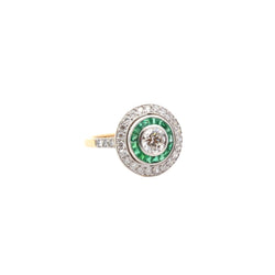 Bague Entourage Art déco en or blanc, platine, émeraudes et diamants - Castafiore