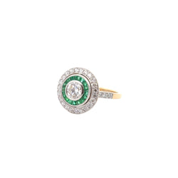 Bague Entourage Art déco en or blanc, platine, émeraudes et diamants - Castafiore