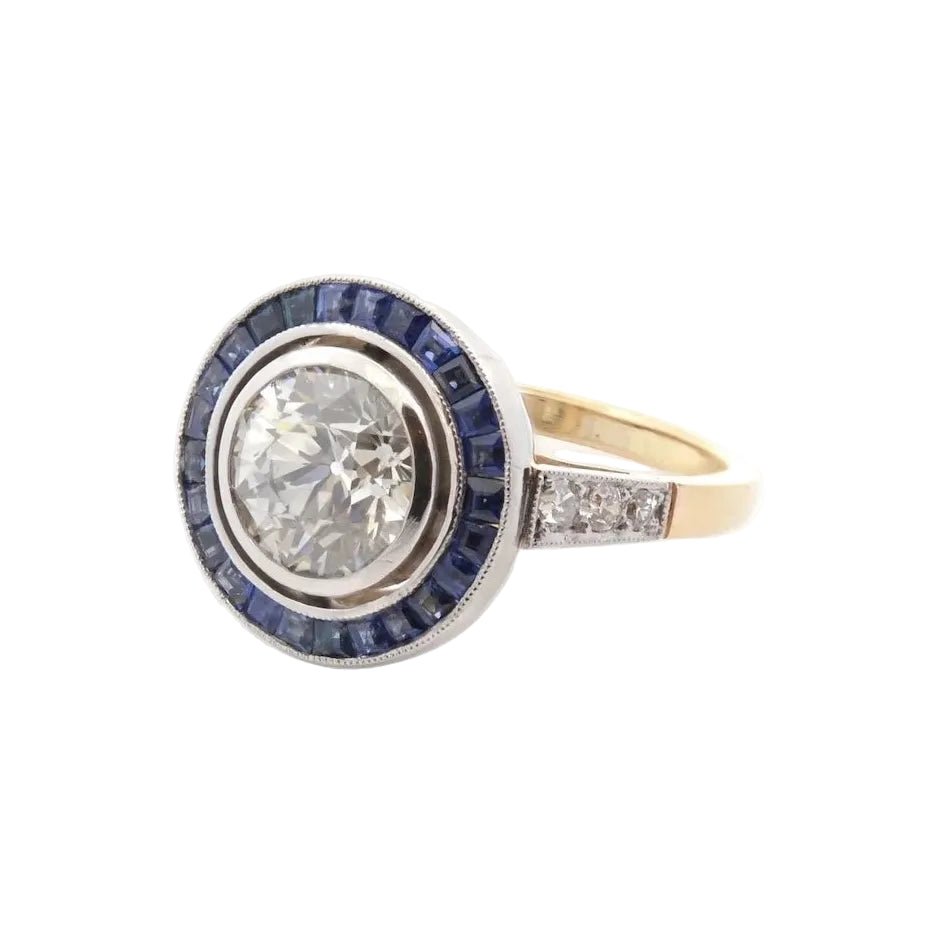 Bague Entourage en or jaune, platine, saphirs et diamants - Castafiore