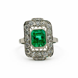 Bague Entourage en platine, émeraude, et diamants - Castafiore