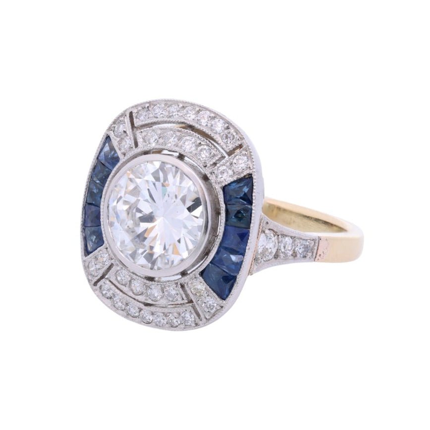 Bague Entourage en platine, saphir et diamants - Castafiore