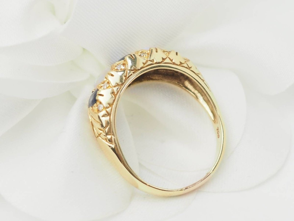 Bague jarretière en or jaune, saphirs et pierres de lune - Castafiore