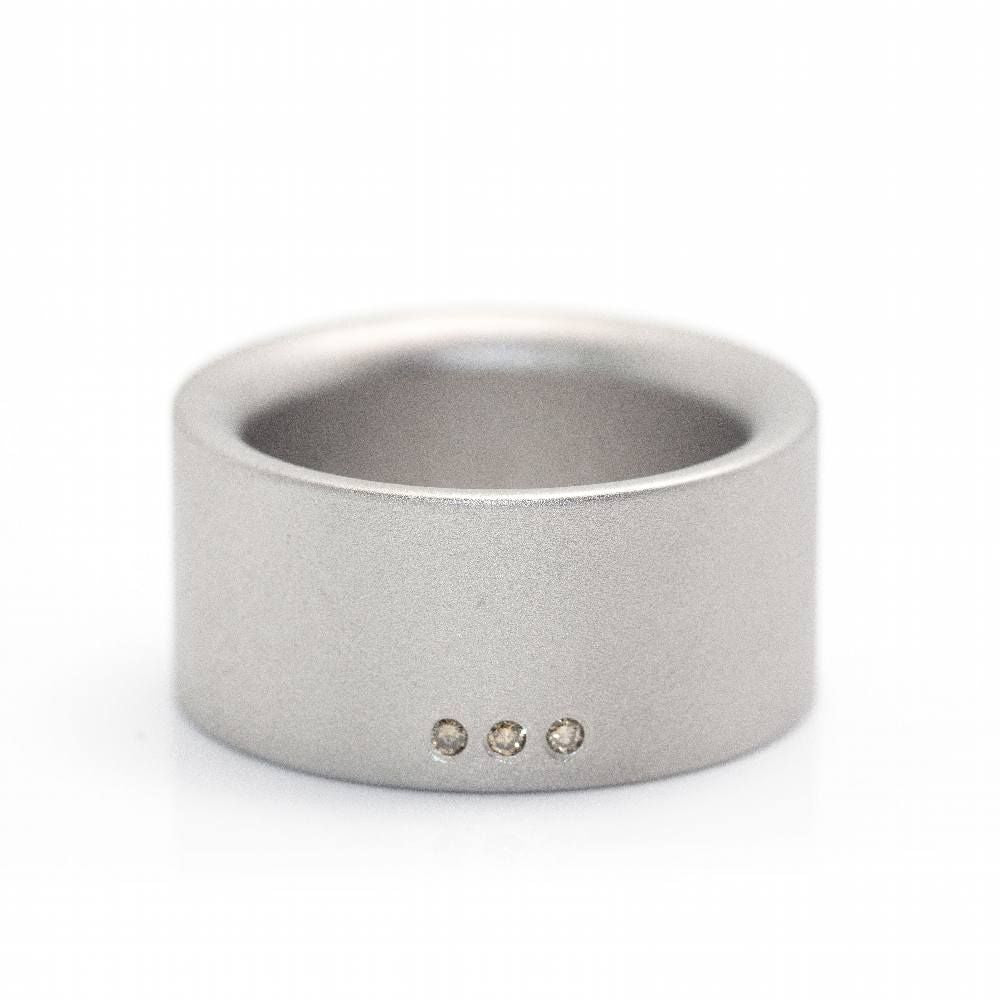 Bague NIESSING en acier et diamants - Castafiore