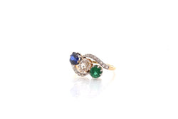 Bague trilogie en or jaune, platine, saphir, émeraude et diamants - Castafiore