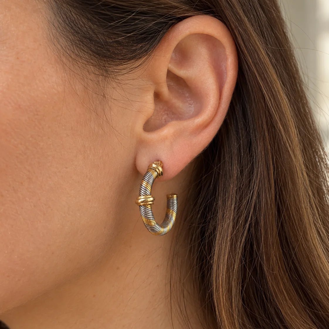 Boucles d’oreilles Créoles CARTIER "Aurore" en or jaune et acier - Castafiore
