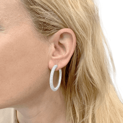 Boucles d'oreilles Créoles CHAUMET "Tube" en or blanc et diamants - Castafiore