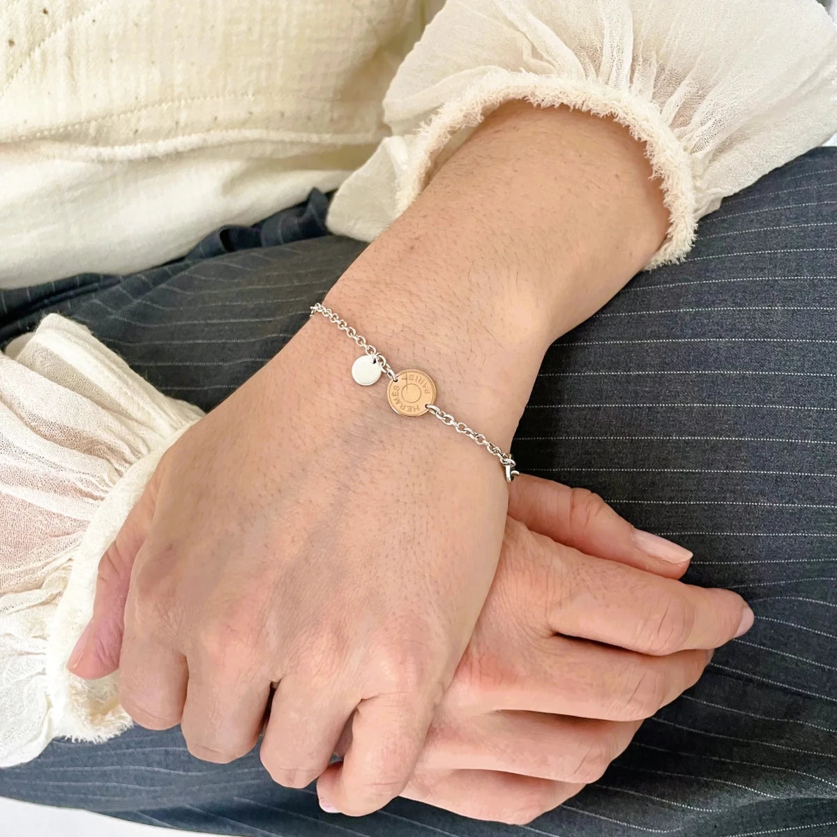 Bracelet Breloques HERMES "Ex-Libris" en argent et or rose - Castafiore