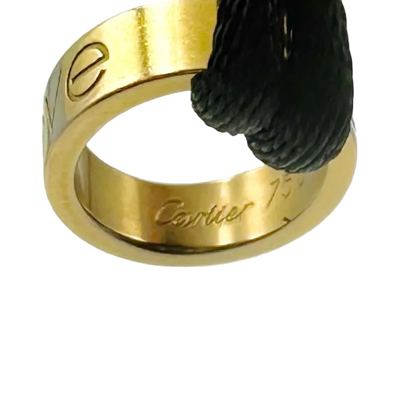 Bracelet CARTIER "Love" en or jaune et cordon - Castafiore