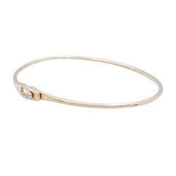 Bracelet Jonc DINH VAN "Serrure" en or jaune, et un diamant. - Castafiore