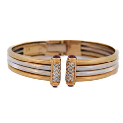 Bracelet Jonc PIAGET en or jaune, rubis et diamants - Castafiore