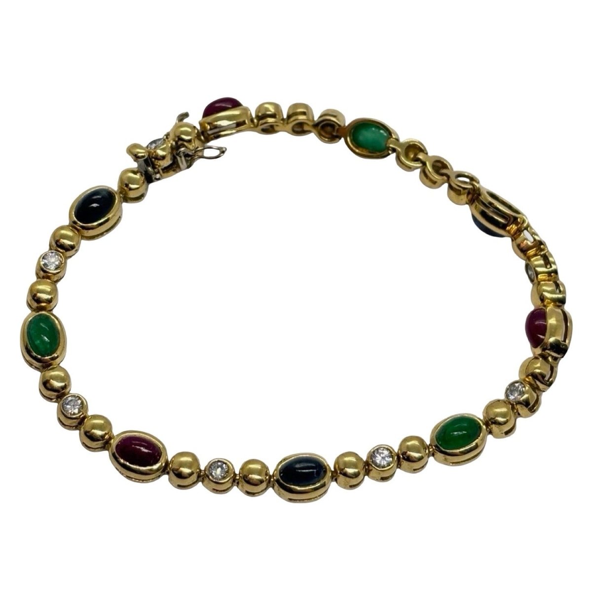 Bracelet Ligne en or jaune, saphirs, émeraudes, rubis et diamants - Castafiore