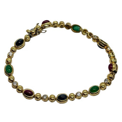 Bracelet Ligne en or jaune, saphirs, émeraudes, rubis et diamants - Castafiore