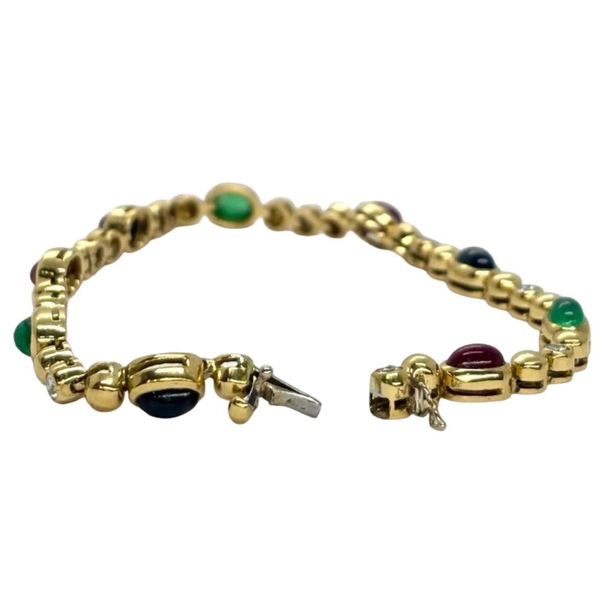 Bracelet Ligne en or jaune, saphirs, émeraudes, rubis et diamants - Castafiore