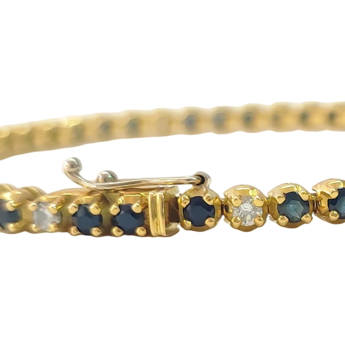 Bracelet Ligne en or jaune, saphirs et diamants - Castafiore