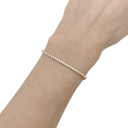Bracelet ligne tennis or jaune, diamants. - Castafiore