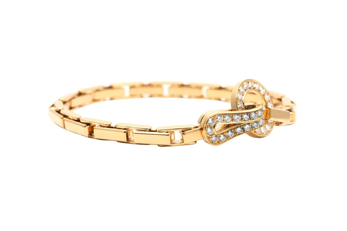 Bracelet Maille CARTIER "Agrafe" en or jaune et diamants - Castafiore