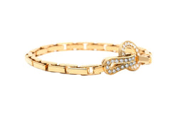 Bracelet Maille CARTIER "Agrafe" en or jaune et diamants - Castafiore