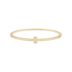 Bracelet Tiffany & Co., "Tiffany T" en or jaune et diamants. - Castafiore