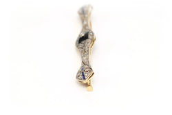 Broche Barrette en or blanc, or jaune, onyx, saphirs et diamants - Castafiore