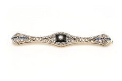 Broche Barrette en or blanc, or jaune, onyx, saphirs et diamants - Castafiore