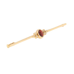 Broche Barrette en or jaune, grenat et diamants - Castafiore
