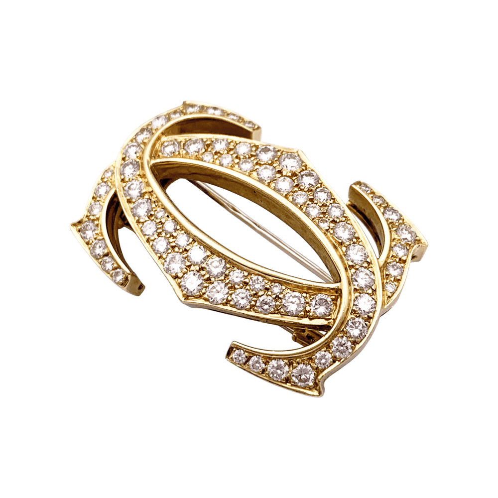 Broche CARTIER "Double C" en or jaune et diamants - Castafiore