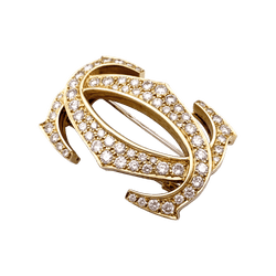 Broche CARTIER "Double C" en or jaune et diamants - Castafiore