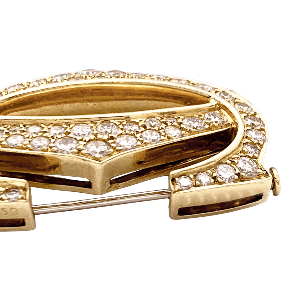 Broche CARTIER "Double C" en or jaune et diamants - Castafiore