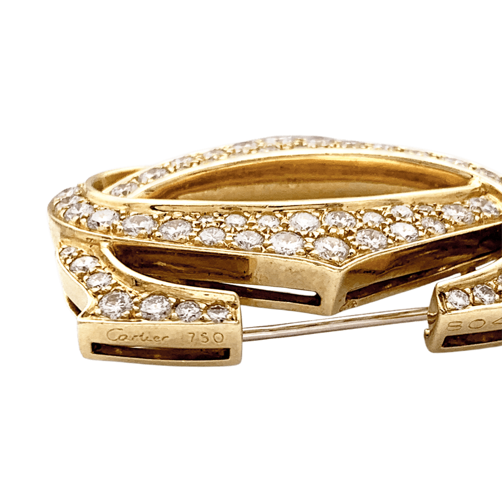 Broche CARTIER "Double C" en or jaune et diamants - Castafiore