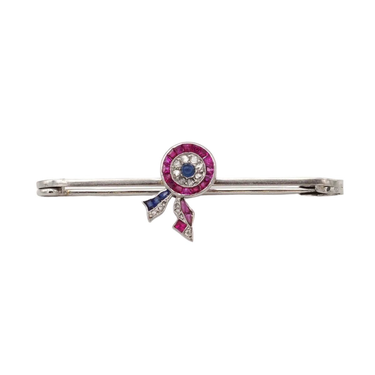 Broche Épingle CARTIER en platine, rubis et saphirs - Castafiore