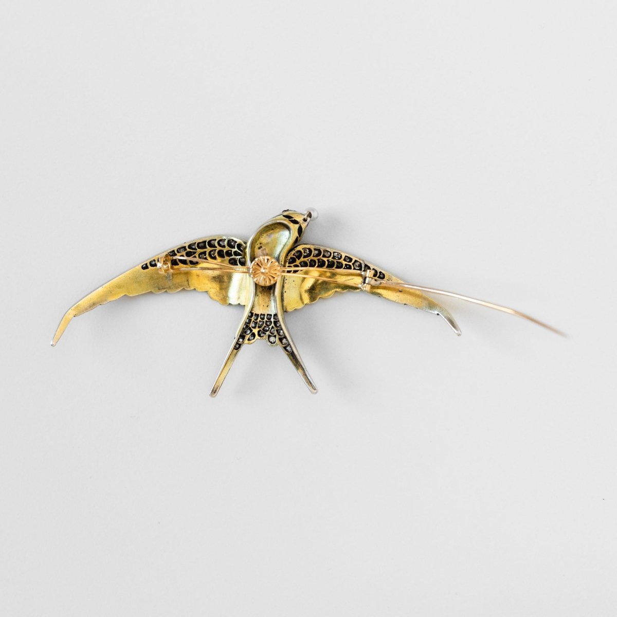 Broche "hirondelle" en or jaune et argent - Castafiore