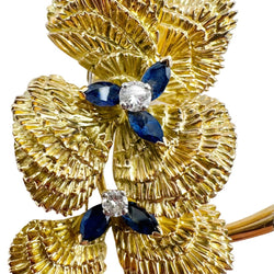 Broche MAUBOUSSIN "Deux fleurs" en or jaune, saphirs et diamant - Castafiore