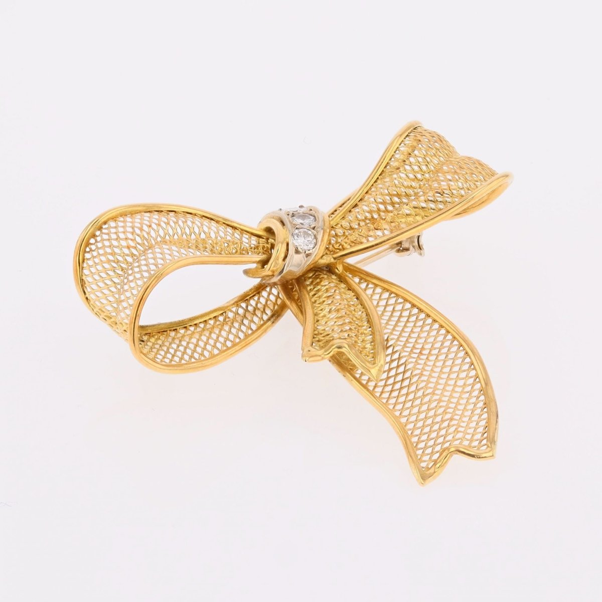 Broche noeud en or jaune et diamants - Castafiore