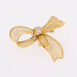 Broche noeud en or jaune et diamants - Castafiore
