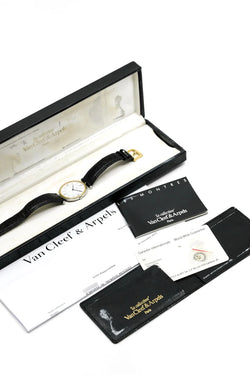 Montre VAN CLEEF & ARPELS "PA 49" en or jaune, acier et cuir