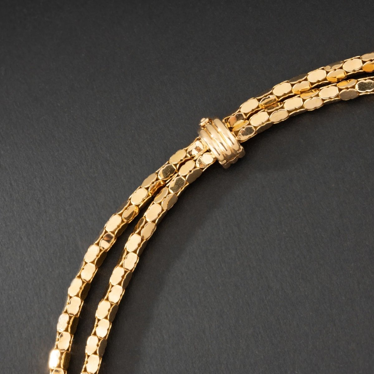 Collier en or jaune 18K à deux rangs, signé MELLERIO. - Castafiore