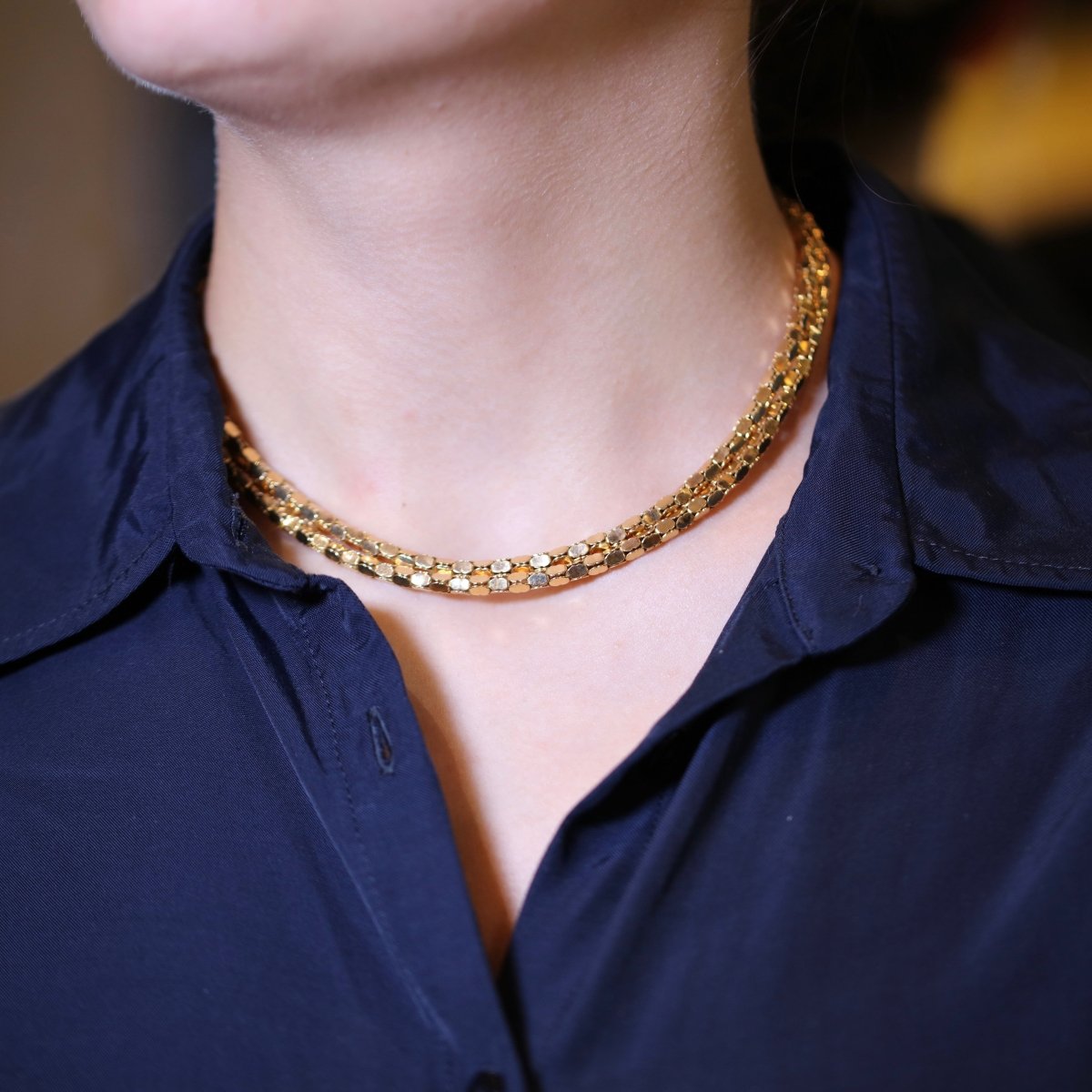Collier en or jaune 18K à deux rangs, signé MELLERIO. - Castafiore