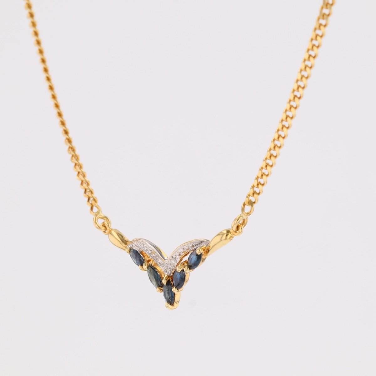 Collier maille gourmette en or jaune et saphirs navette diamants - Castafiore