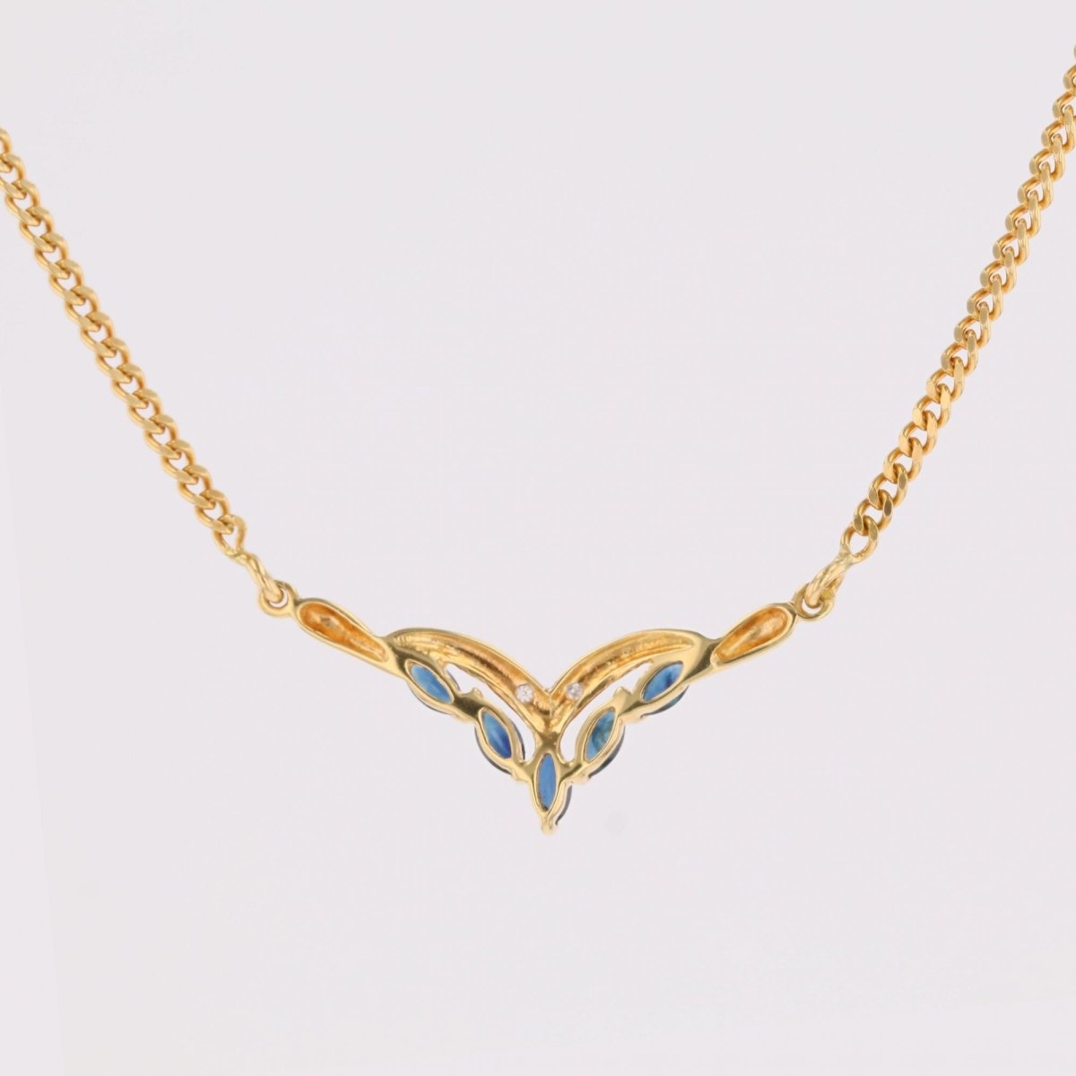 Collier maille gourmette en or jaune et saphirs navette diamants - Castafiore