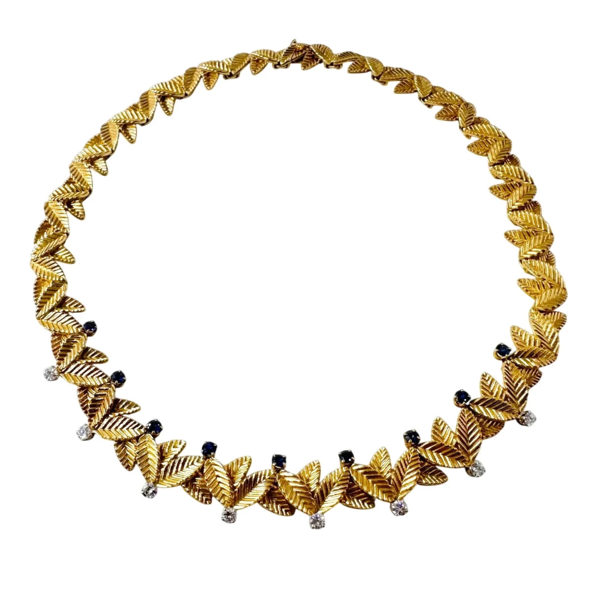 Collier Ras de Cou VAN CLEEF & ARPELS Feuilles en or jaune, saphirs et diamants - Castafiore